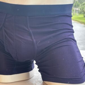 Mannequin wearing dark blue boxer briefs.